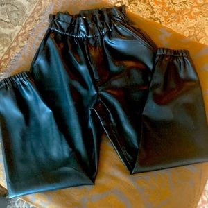 Paper bag waisted faux leather pants.